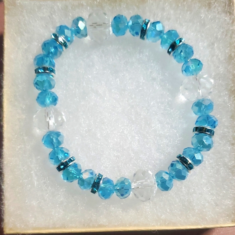 Handmade by my daughter. Blue and Clear Beaded Bracelet